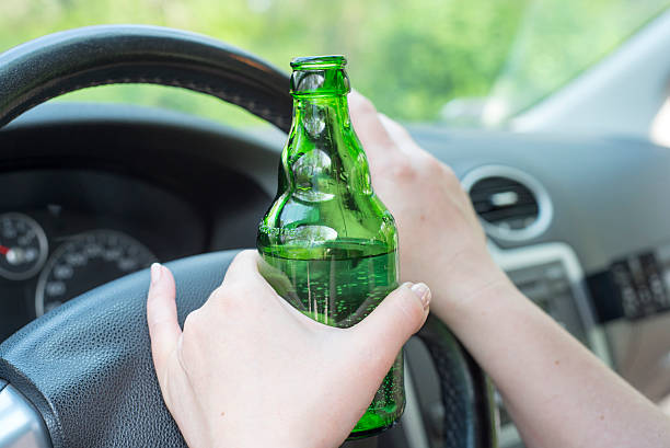 istock Woman drinking alcohol in the car. 539831844
