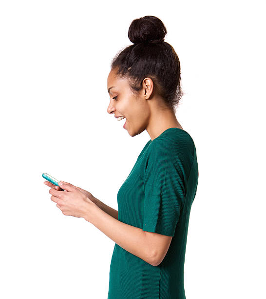 istock Smiling young african woman using mobile phone 539832378