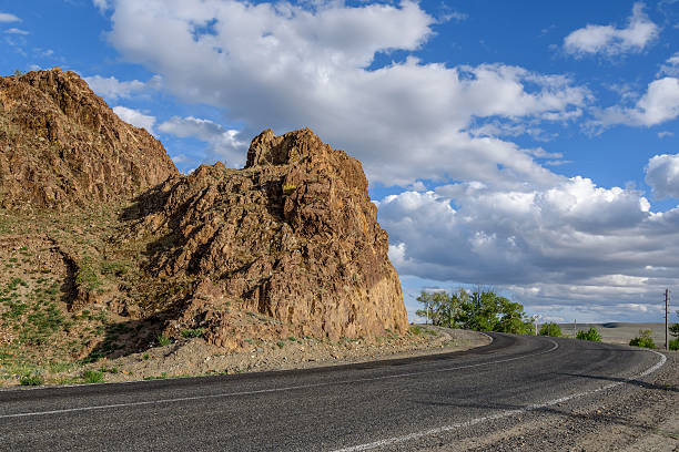 istock road mountains clouds curve asphalt red 539832664