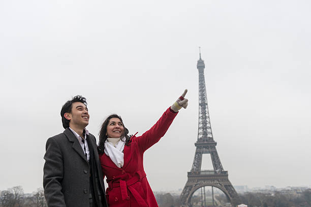 Mother and son in front of Eiffel Tower, Paris, France