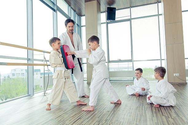 istock young, beautiful, successful multi ethical kids in karate position 539834762
