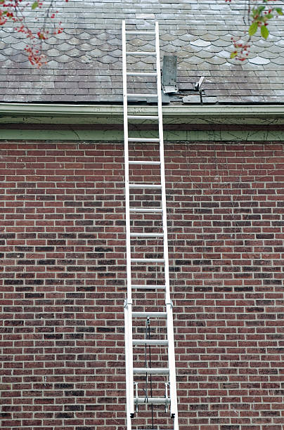 istock Ladder Against Slate Roof With Tools 539836062