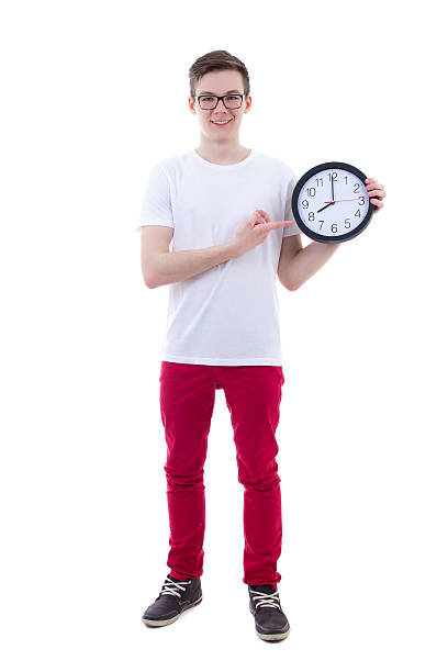 istock handsome teenage boy showing office clock isolated on white 539837172