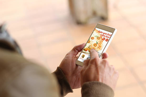 istock Brown young man smartphone order food 539837184