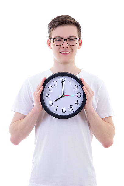 istock handsome teenage boy holding office clock isolated on white 539837264