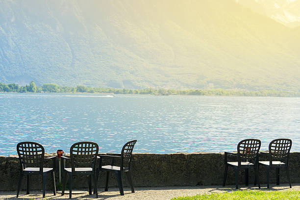 istock Chairs lined up near the lake in evening 539839142