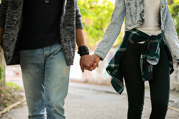 istock Couple holding hands outdoors. 539840128