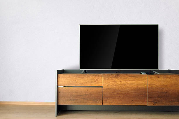 istock Led TV on TV stand with white wall 539840646
