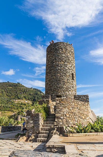Vernazza, Italy - October 20, 2015: Unidentified tourists on the stone tower of Castello Doria, Vernazza, Cinque Terre, Liguria, Italy