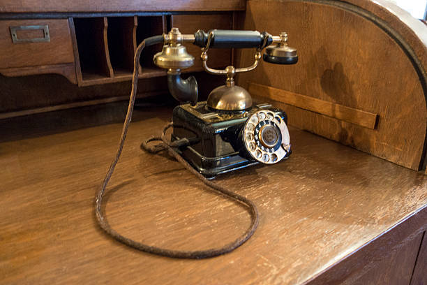 istock Old telephone and desk 539843230