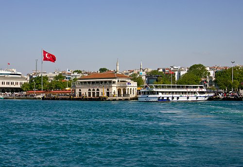 Istanbul, Turkey - May 8, 2016: Haydarpasha Station and passenger ship on the bosphorus. Haydarpasha is a major intercity rail station and transportation hub in İstanbul. It is the busiest rail terminal in Turkey and the Middle East and one of the busiest in Eastern Europe. The terminal also has connections to İETT bus and ferry service.