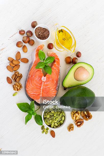 Food Sources Of Omega 3 And Healthy Fats Top View Stock Photo - Download Image Now - Acid, Almond, Avocado