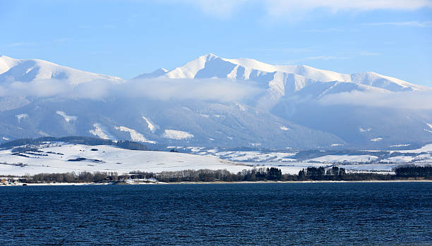 istock Tatra Mountains and big lake at winter time 539847396