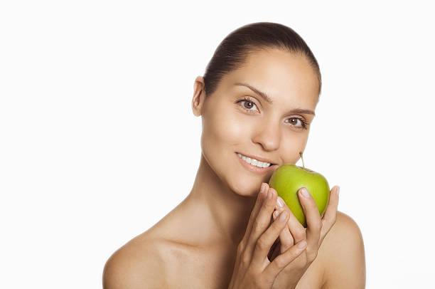 istock Girl with green apple in hands 539847758