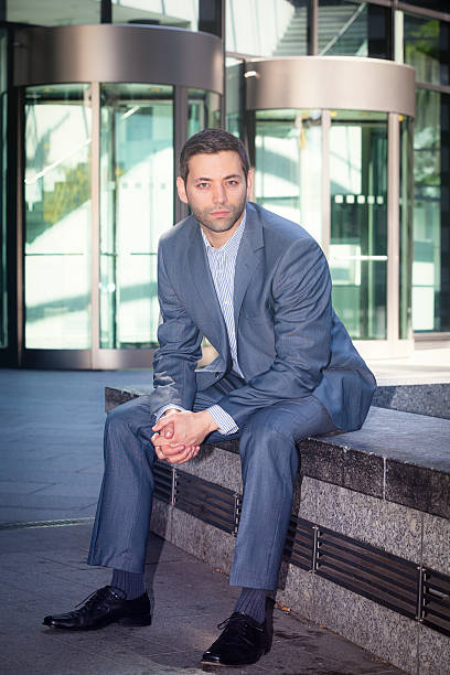 istock businessman sitting outdoors 539848312