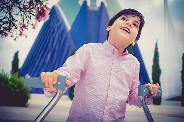 Disability child, walking sticks, cerebral palsy, smiling
