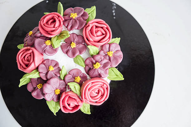 istock cake decorated by edible cream flowers 539851794