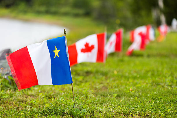 A row of Acadian and Canadian flags, as seen in the Acadian region of New Brunswick, Canada.
