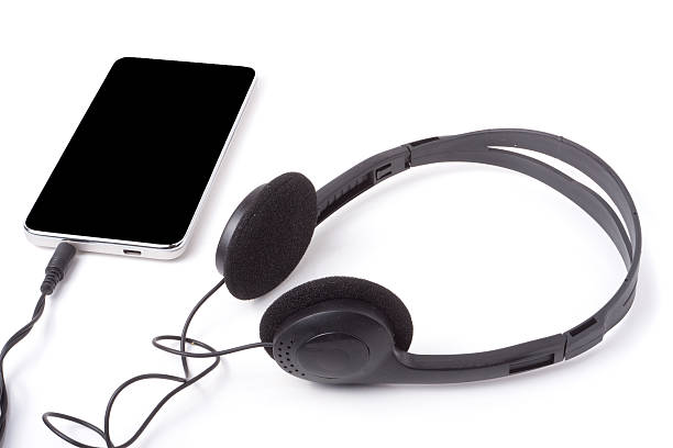 istock black headphones with the phone isolated on white background 539853336