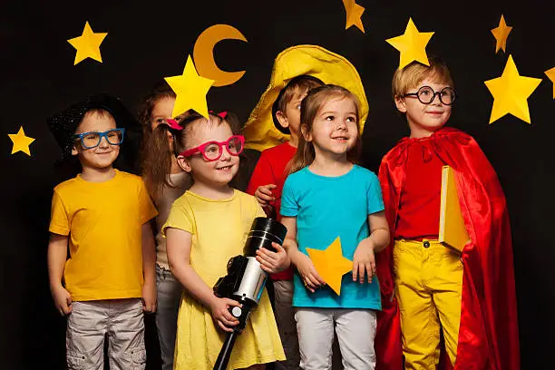 Photo of Six friends in sky watcher costumes watching stars