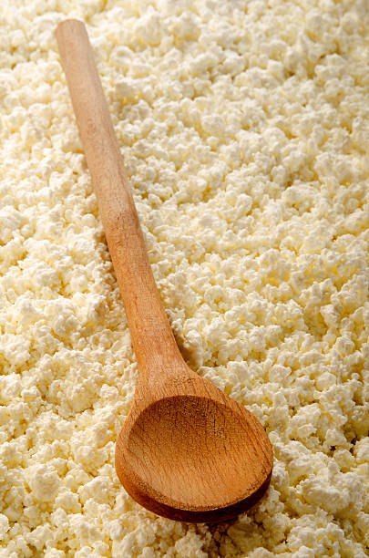 istock home made cottage cheese with wooden spoon 539943108