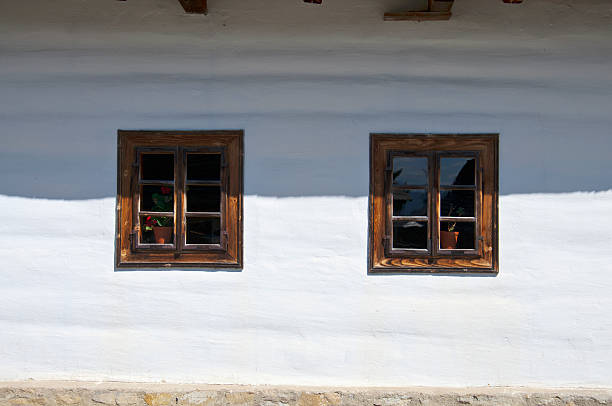 Old style house detail from outside with two windows