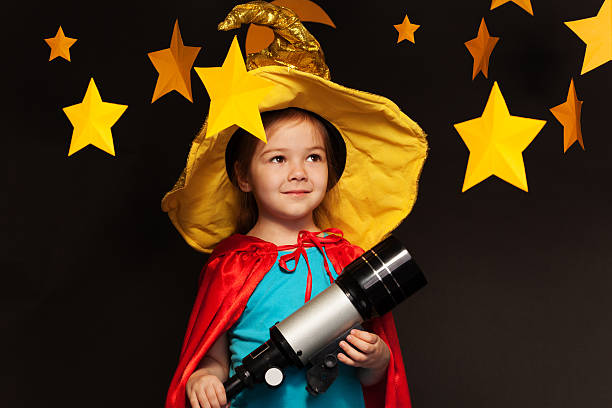 istock Beautiful dreamer stargazing through a telescope 539944884