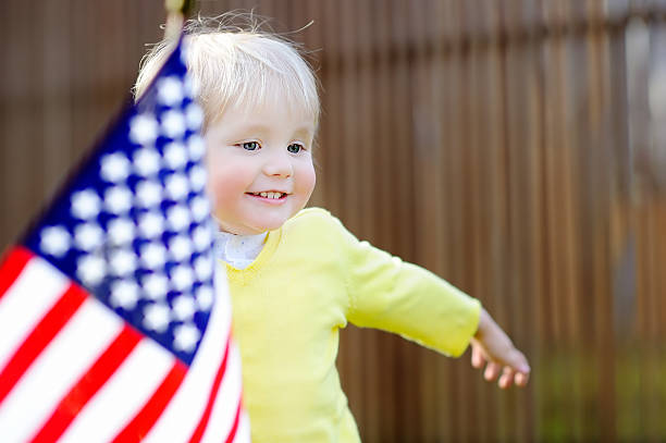 istock Cute toddler boy with american flag 539945144