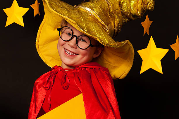 istock Cute little boy in glasses and sky watcher costume 539945544