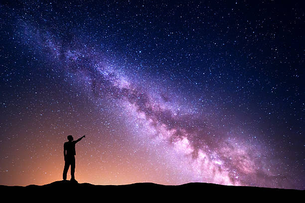istock Milky Way with silhouette of a standing man 539946286