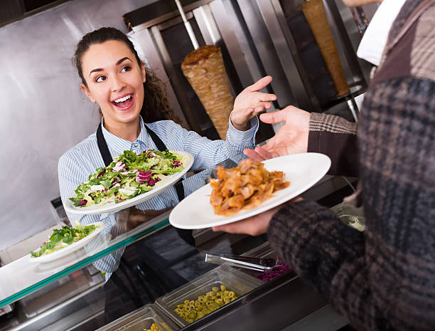 istock Adult  female worker serving customer 539947330