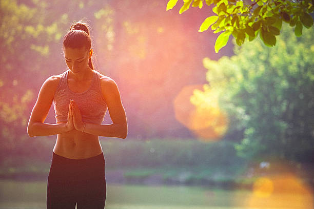 istock Young woman meditates prior to karate training 539947478