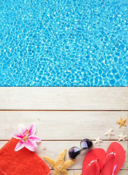 istock Beach accessories on wooden background with pool 539948762
