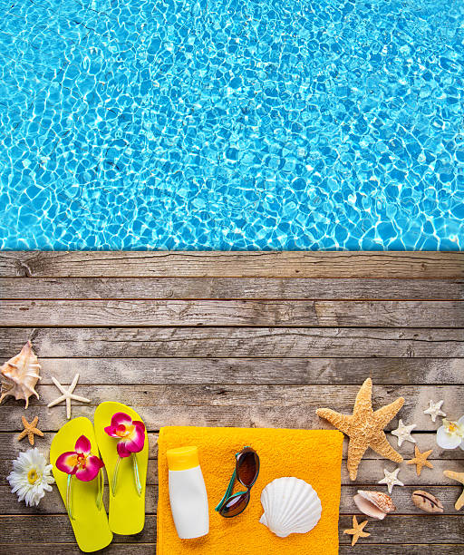 istock Beach accessories on wooden background with pool 539949020