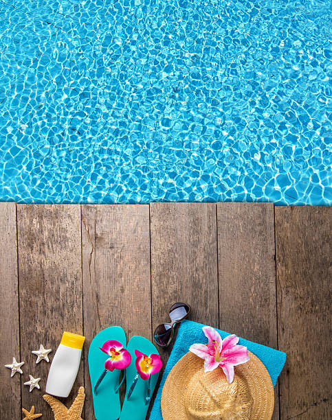 istock Beach accessories on wooden background with pool 539949230