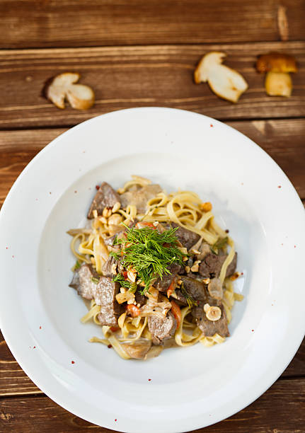 istock Pasta with mushrooms nuts and meat 539949326