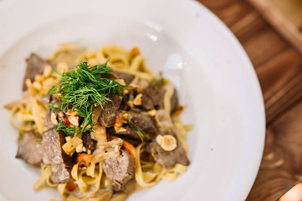 istock Pasta with mushrooms nuts and meat 539949482
