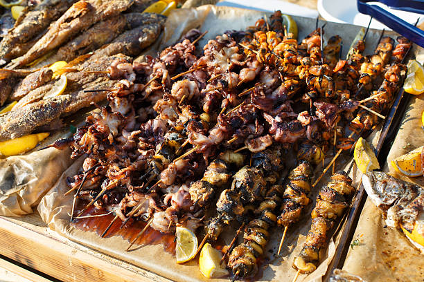 istock Seafood, fish, octopus grilled at barbecue 539949594