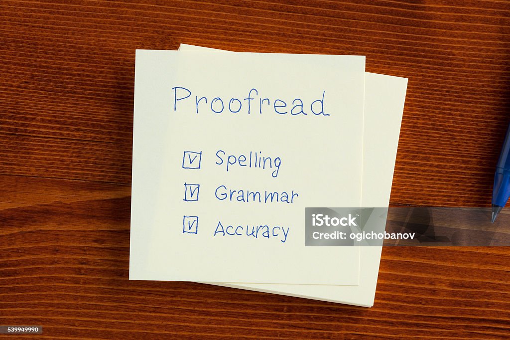 Proofread written on a note Proofread note with check boxes for spelling, grammar and accuracy. Proofreading Stock Photo