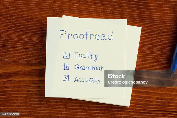 Proofread Written On A Note Stock Photo - Download Image Now - Proofreading, Check Mark, Spelling - Education