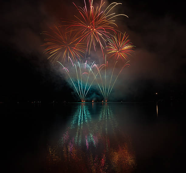 istock Colorful fireworks with reflection on lake. 539953038