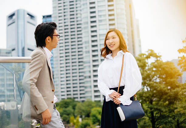 istock Japanese couple flirting in Tokyo downtown 539954844