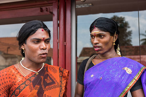 Chettinad, India - October 17, 2013: Portrait of Ms. Abinaja and Ms. Sheila, both Hijras, transgender persons. Hijras are males who dresses and acts like a woman. Have a sacred status in Hinduism. Dark, open faces, saris and jewelry. Karaikudi city.