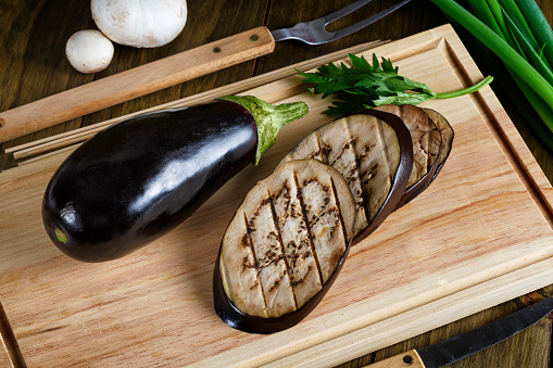 Grilled slices of Eggplant on cutting board
