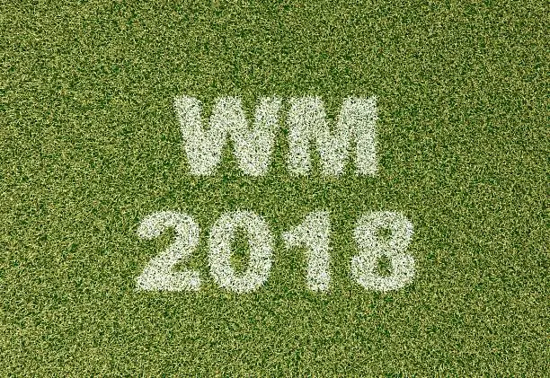 realistic textured grass football - soccer field. WM 2018 - written with white grass on the green football field