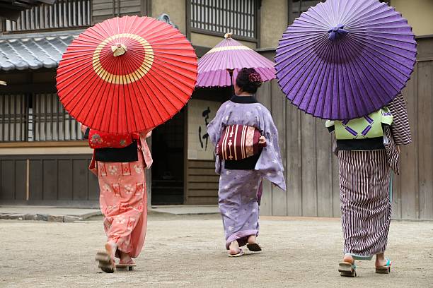 istock Japanese women walking with umbrella 539960156