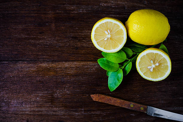istock Fresh lemons on wooden background. 539961798