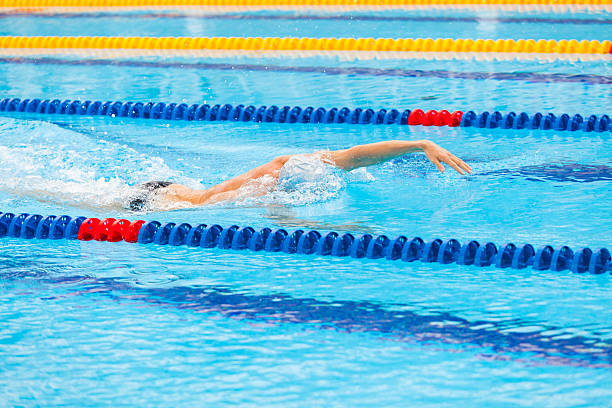 istock Man swimmer swimming crawl in blue water. 539966426