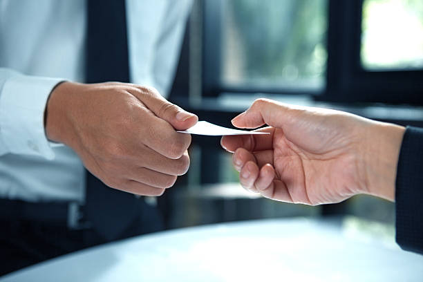 istock business executive exchanging business card 539967184