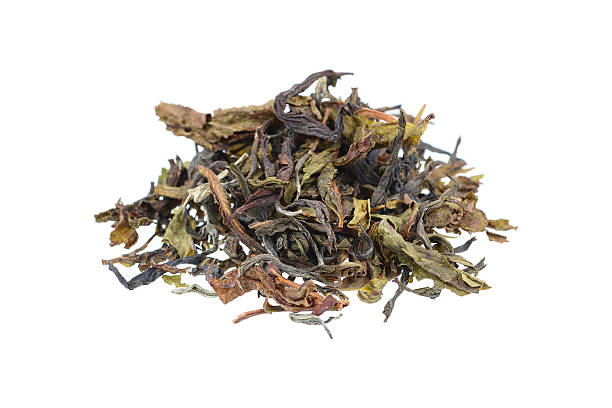 istock dry tea leaves isolated on white 539967590